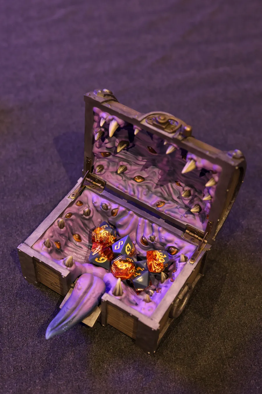 Top-down view of the open Mimic Dice Box filled with dice