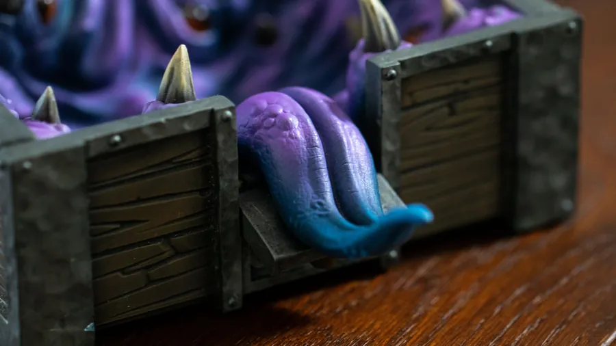 Close-up of the Mimic Dice Box's tongue and teeth over the front edge