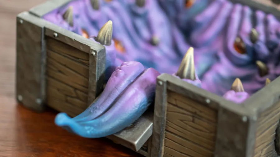 Macro of the Mimic Dice Box's painted tongue and a gold tooth