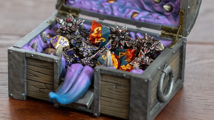 The open Mimic Dice Box hoarding a pile of metal dice