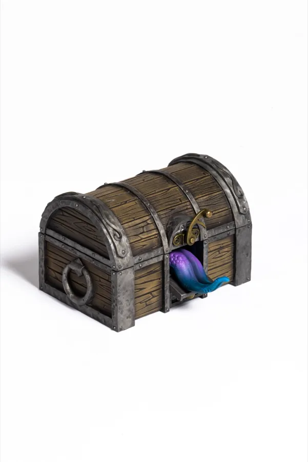 The tongue of the Mimic Dice Box peeking out of the closed chest
